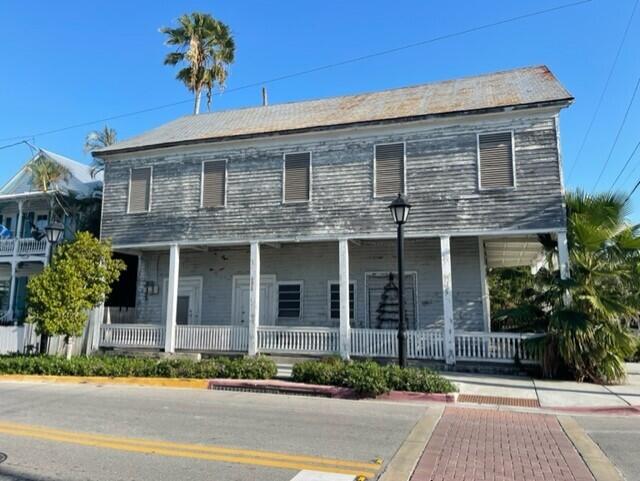 301 Elizabeth Street Key West, FL 33040 - Photo 1 of 6 a front view of a house with a garden and plants