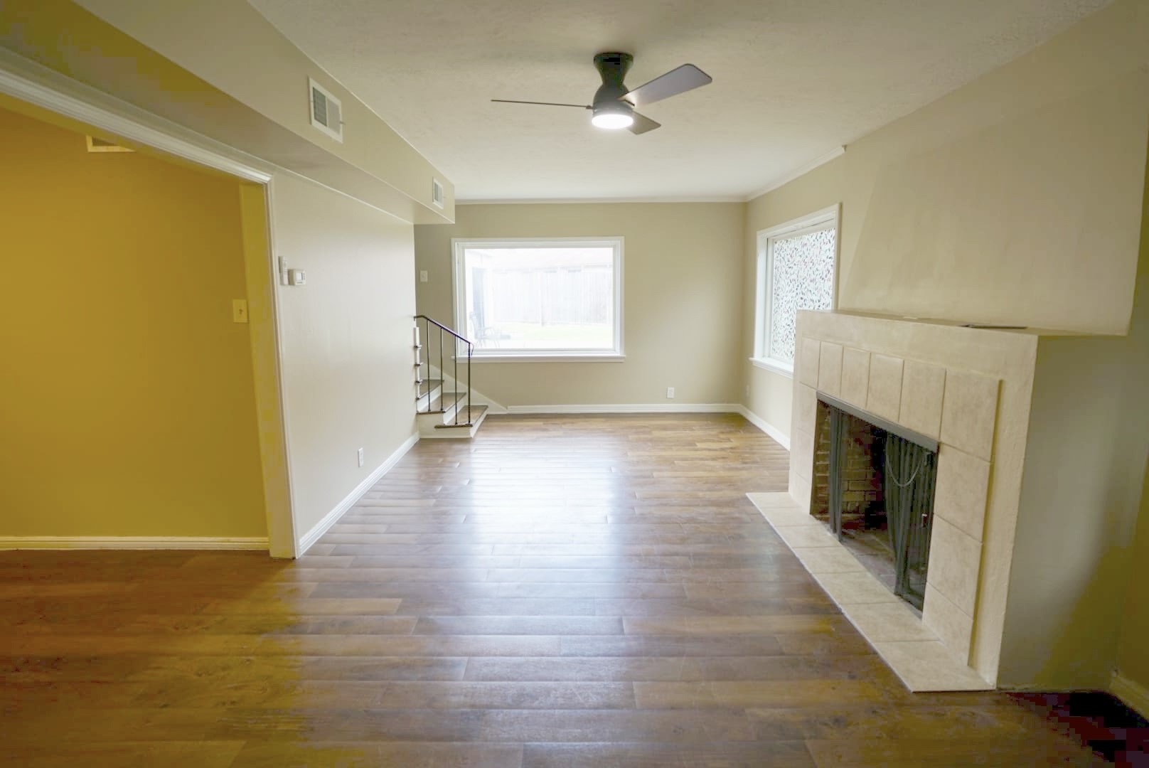 3309 Lawrence Street Houston, TX 77018 - Photo 1 of 21 a view of empty room with wooden floor and fireplace