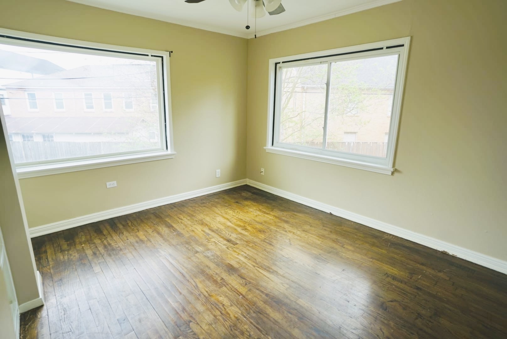 3309 Lawrence Street Houston, TX 77018 - Photo 11 of 21 a view of an empty room with wooden floor and a window