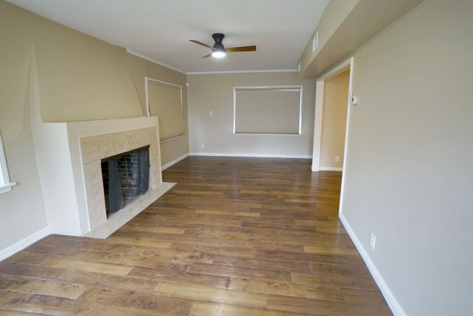 3309 Lawrence Street Houston, TX 77018 - Photo 2 of 21 a view of a livingroom with wooden floor and a fireplace
