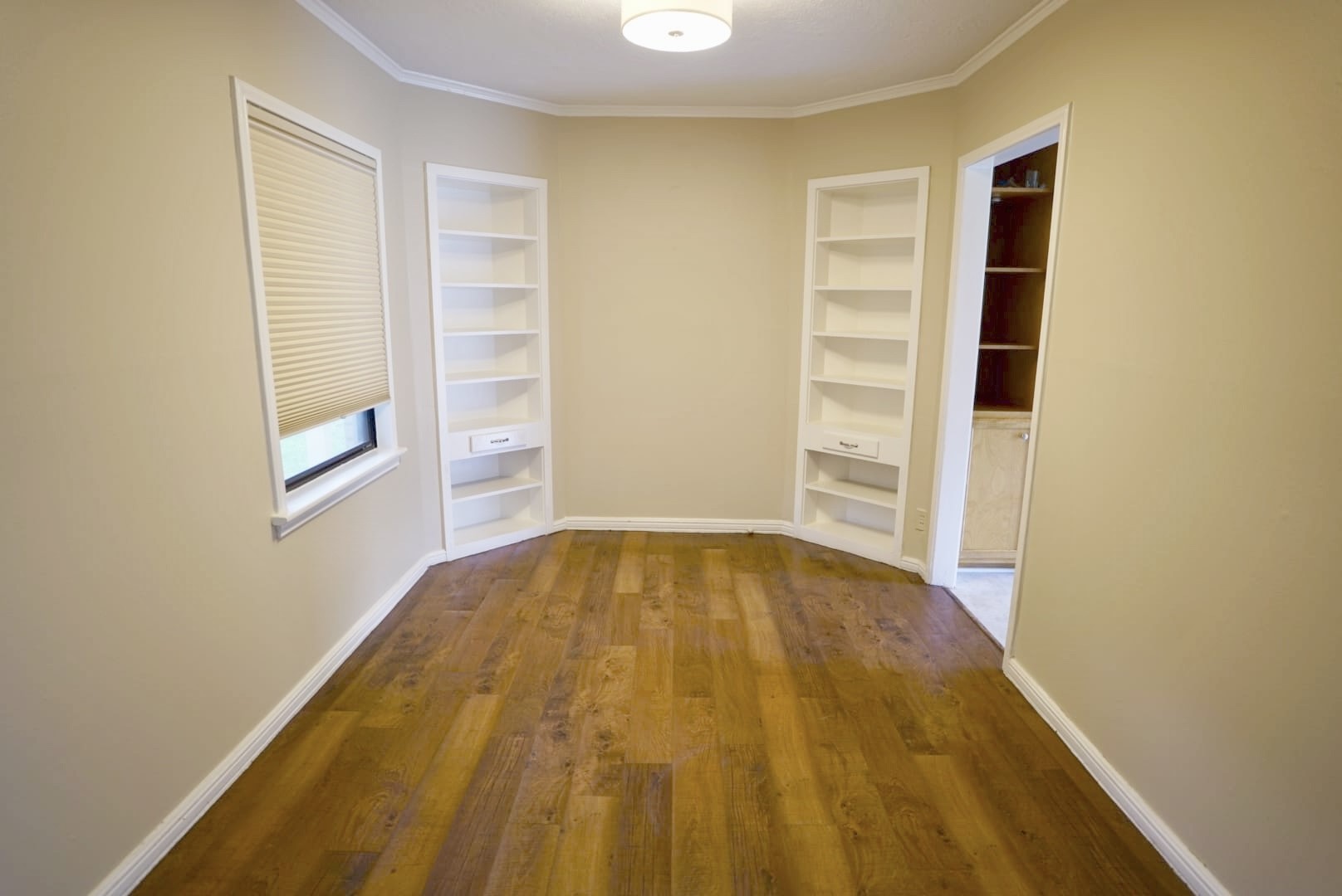 3309 Lawrence Street Houston, TX 77018 - Photo 3 of 21 a view of an empty room with wooden floor and closet