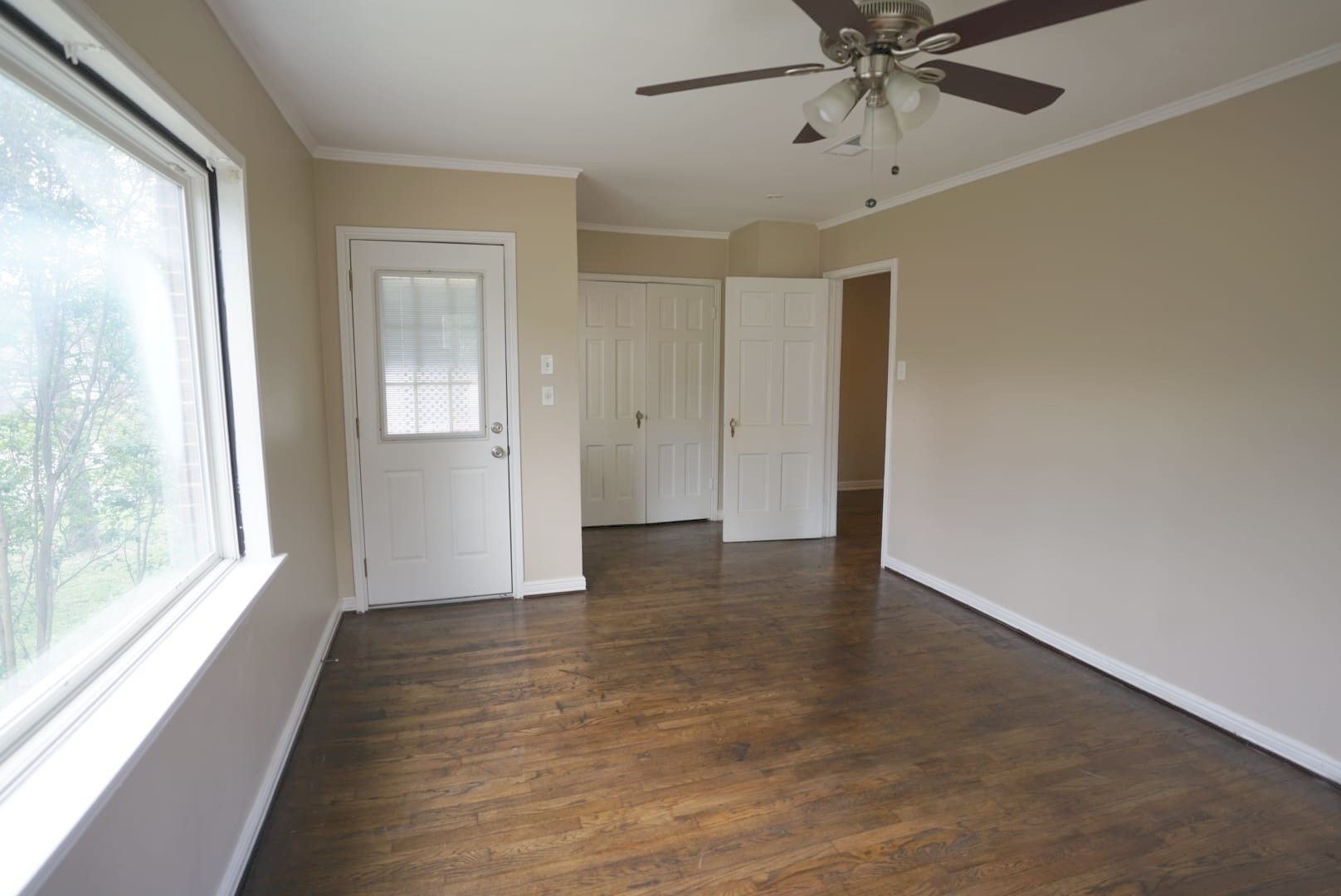 3309 Lawrence Street Houston, TX 77018 - Photo 8 of 21 a view of an empty room with wooden floor and a window