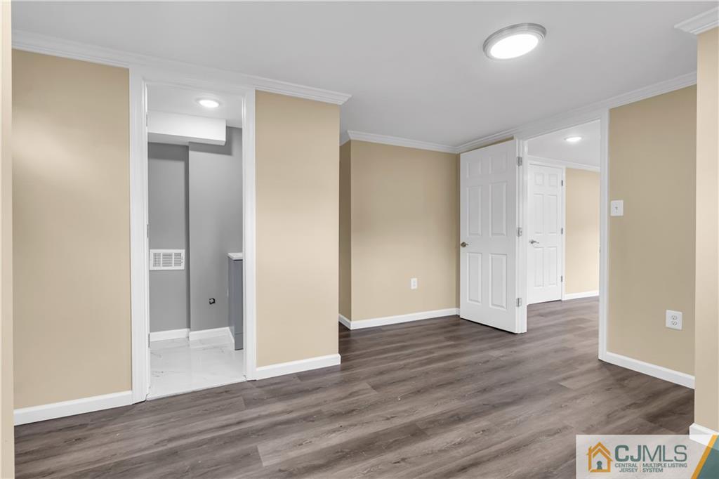 9 Nancy Circle Edison, NJ 08817 - Photo 13 of 38 a view of an empty room with wooden floor