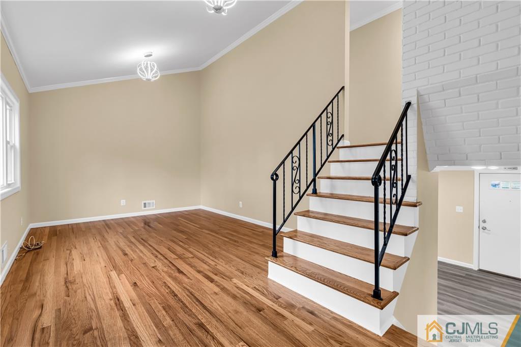 9 Nancy Circle Edison, NJ 08817 - Photo 15 of 38 a view of entryway with wooden floor and stairs