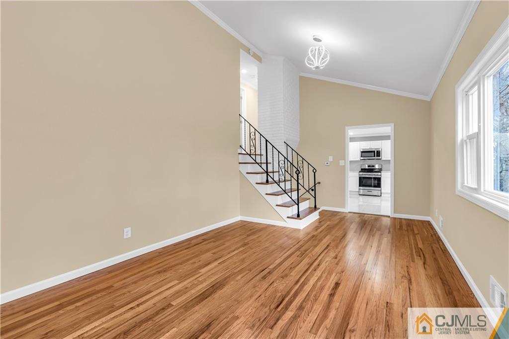9 Nancy Circle Edison, NJ 08817 - Photo 17 of 38 wooden floor in a hall with an entryway