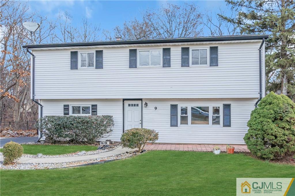 9 Nancy Circle Edison, NJ 08817 - Photo 2 of 38 a front view of a house with a yard