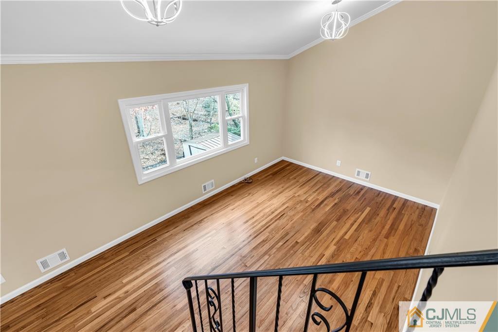 9 Nancy Circle Edison, NJ 08817 - Photo 24 of 38 a view of an empty room with windows