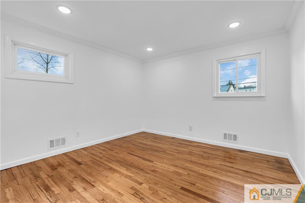9 Nancy Circle Edison, NJ 08817 - Photo 25 of 38 a view of empty room with wooden floor