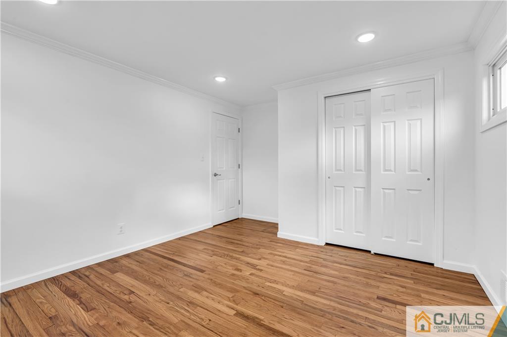 9 Nancy Circle Edison, NJ 08817 - Photo 26 of 38 a view of empty room with wooden floor