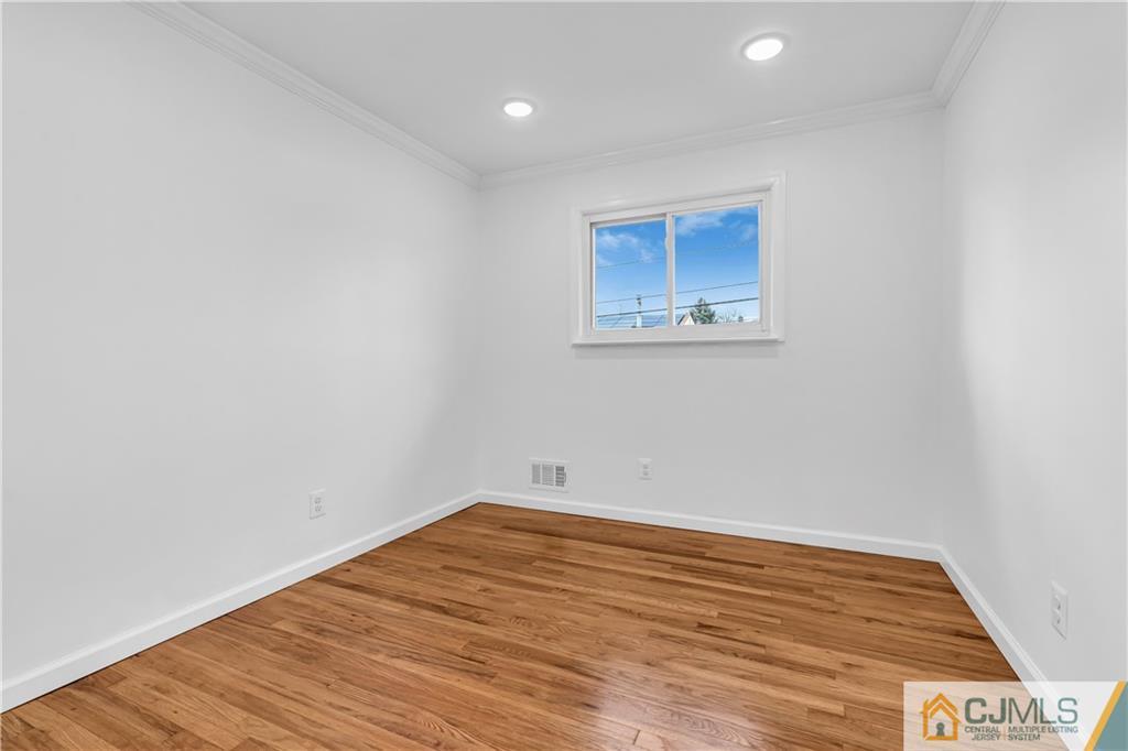 9 Nancy Circle Edison, NJ 08817 - Photo 27 of 38 a view of empty room with wooden floor