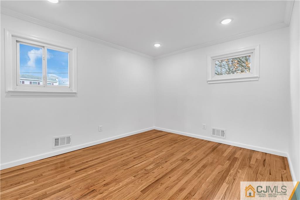 9 Nancy Circle Edison, NJ 08817 - Photo 28 of 38 a view of empty room with wooden floor
