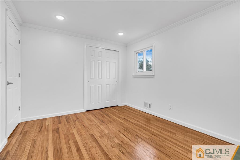 9 Nancy Circle Edison, NJ 08817 - Photo 29 of 38 a view of empty room with wooden floor