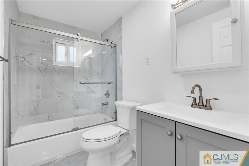 9 Nancy Circle Edison, NJ 08817 - Photo 30 of 38 a bathroom with a sink toilet and shower