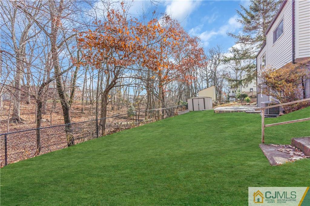 9 Nancy Circle Edison, NJ 08817 - Photo 36 of 38 a view of a park with large trees