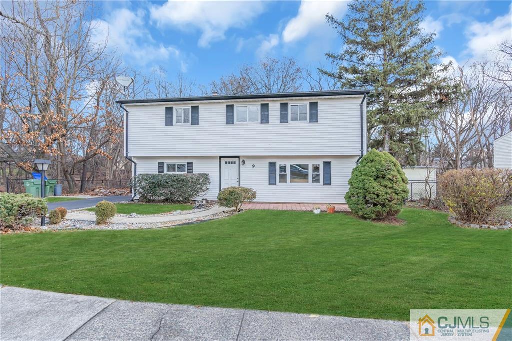 9 Nancy Circle Edison, NJ 08817 - Photo 5 of 38 a view of a house with a yard and sitting area