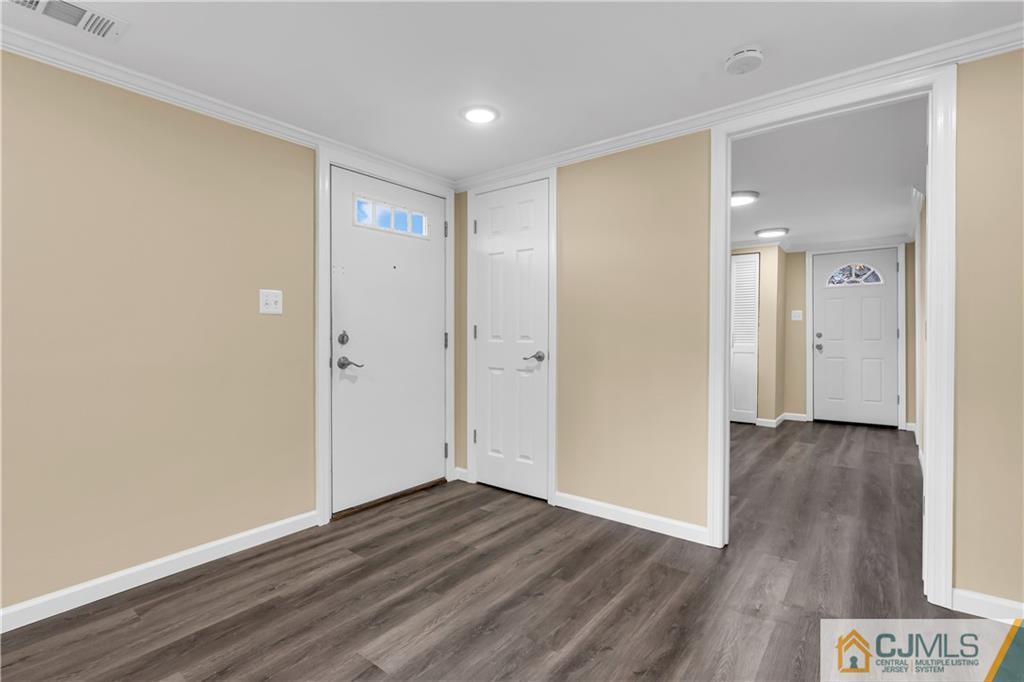 9 Nancy Circle Edison, NJ 08817 - Photo 7 of 38 a view of an empty room with wooden floor