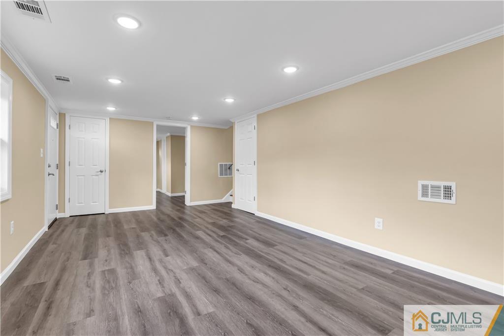 9 Nancy Circle Edison, NJ 08817 - Photo 10 of 38 a view of an empty room with wooden floor