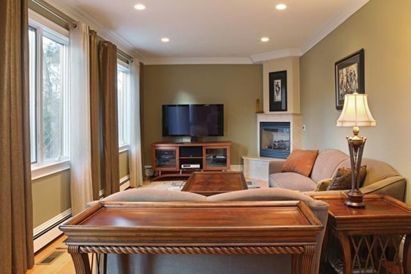 151 Bellingham Road Brookline, MA 02467 - Photo 3 of 14 a bedroom with a bed and wooden floor