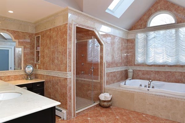 151 Bellingham Road Brookline, MA 02467 - Photo 9 of 14 a bathroom with a sink and a mirror
