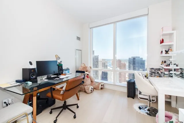 a workspace with furniture and a window