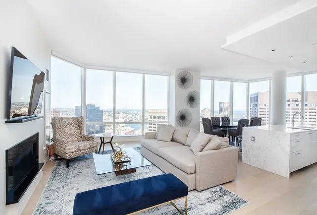 a living room with furniture fireplace and a flat screen tv