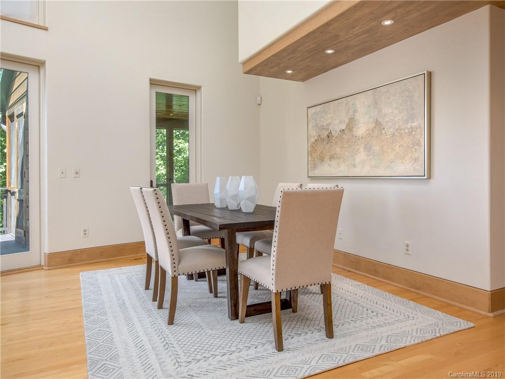 136 High Rock Ridge Drive Landrum, SC 29356 - Photo 21 of 44 a view of a dining room with furniture window and wooden floor