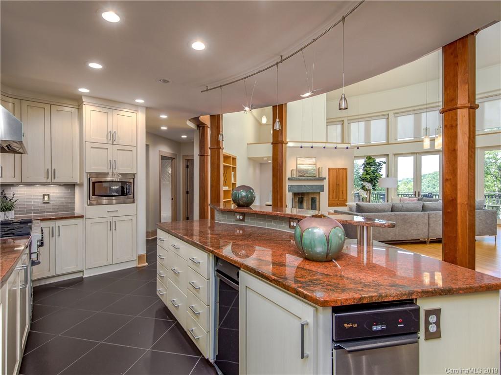 136 High Rock Ridge Drive Landrum, SC 29356 - Photo 26 of 44 a kitchen with counter top space cabinets and stainless steel appliances