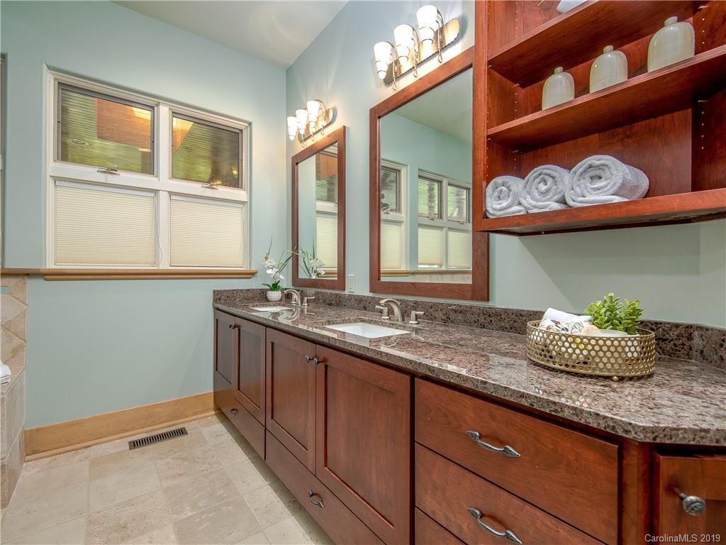 136 High Rock Ridge Drive Landrum, SC 29356 - Photo 31 of 44 a bathroom with a granite countertop sink and a window