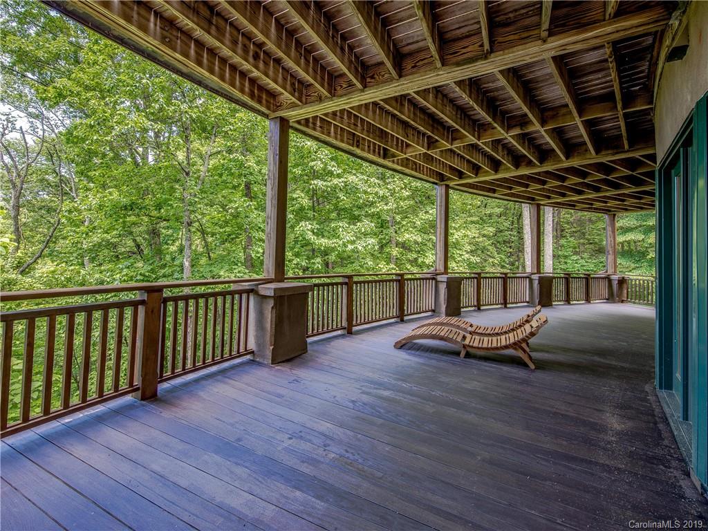 136 High Rock Ridge Drive Landrum, SC 29356 - Photo 39 of 44 a view of a deck with wooden floor and outdoor seating