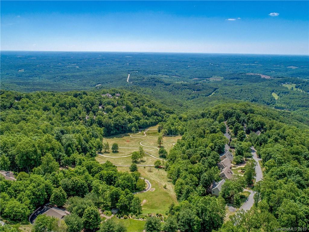 136 High Rock Ridge Drive Landrum, SC 29356 - Photo 5 of 44 a view of a lake and green space