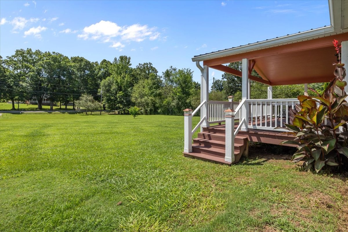 1112 Garners Creek Road Dickson, TN 37055 - Photo 33 of 57 a backyard of a house with table and chairs