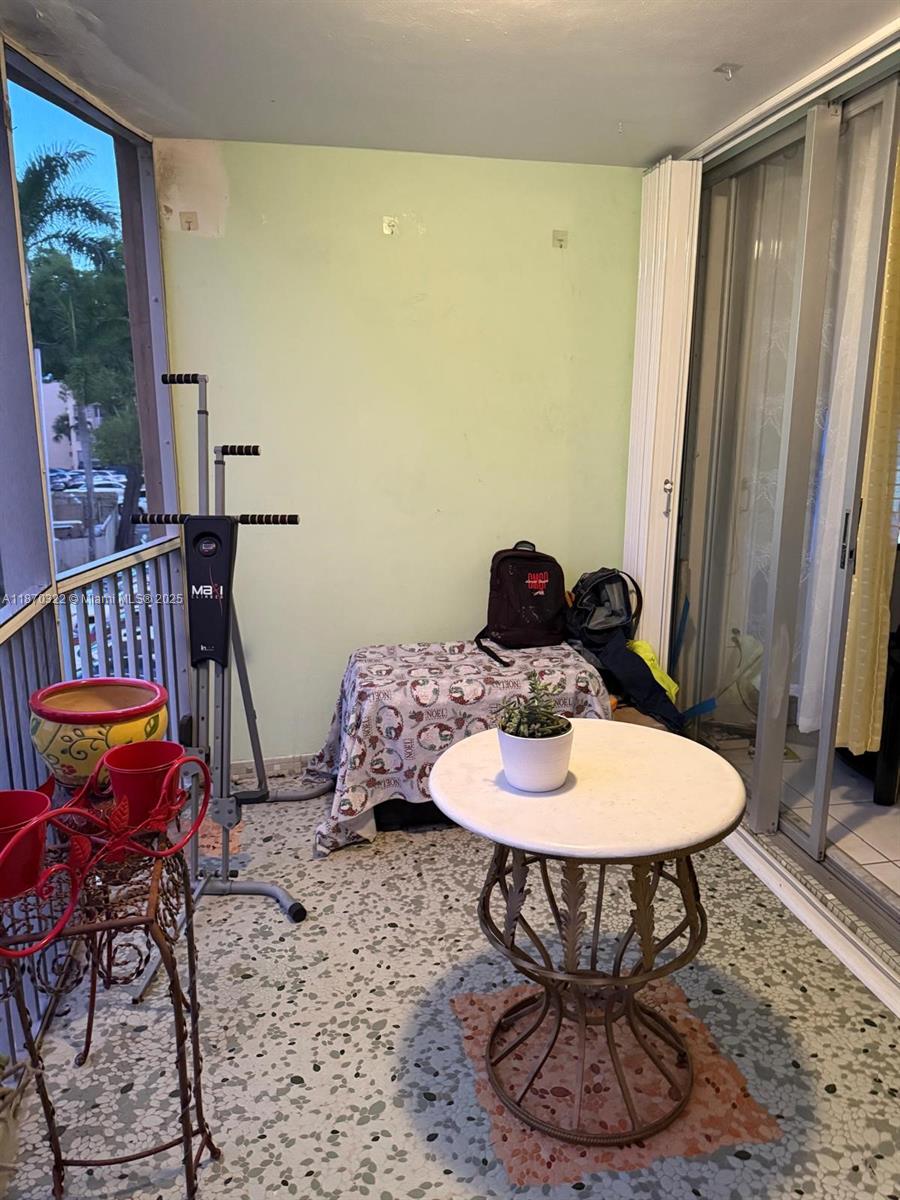 1710 Northeast 191st Street, Unit 3173 Miami, FL 33179 - Photo 6 of 18 a dining room with furniture and wooden floor