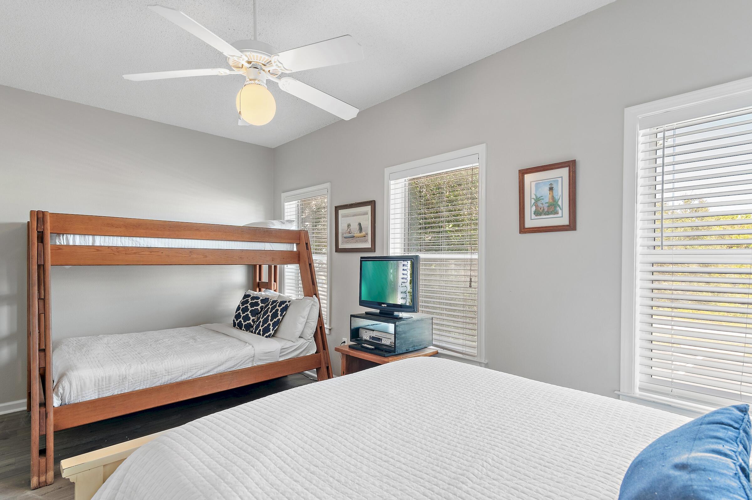 69 Seabreeze Trail Inlet Beach, FL 32461 - Photo 20 of 40 a bedroom with a large bed and a chandelier