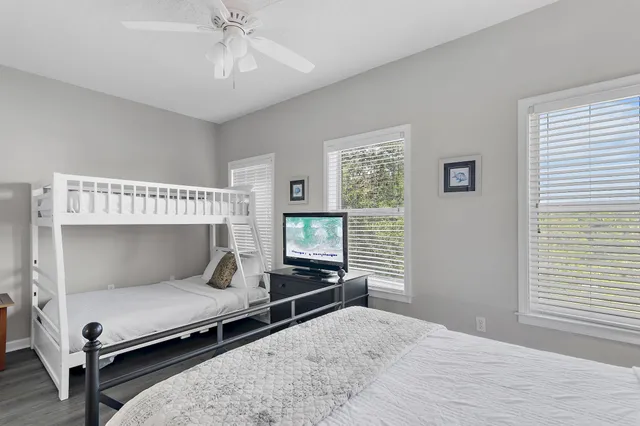 a bathroom with a sink vanity mirror and toilet