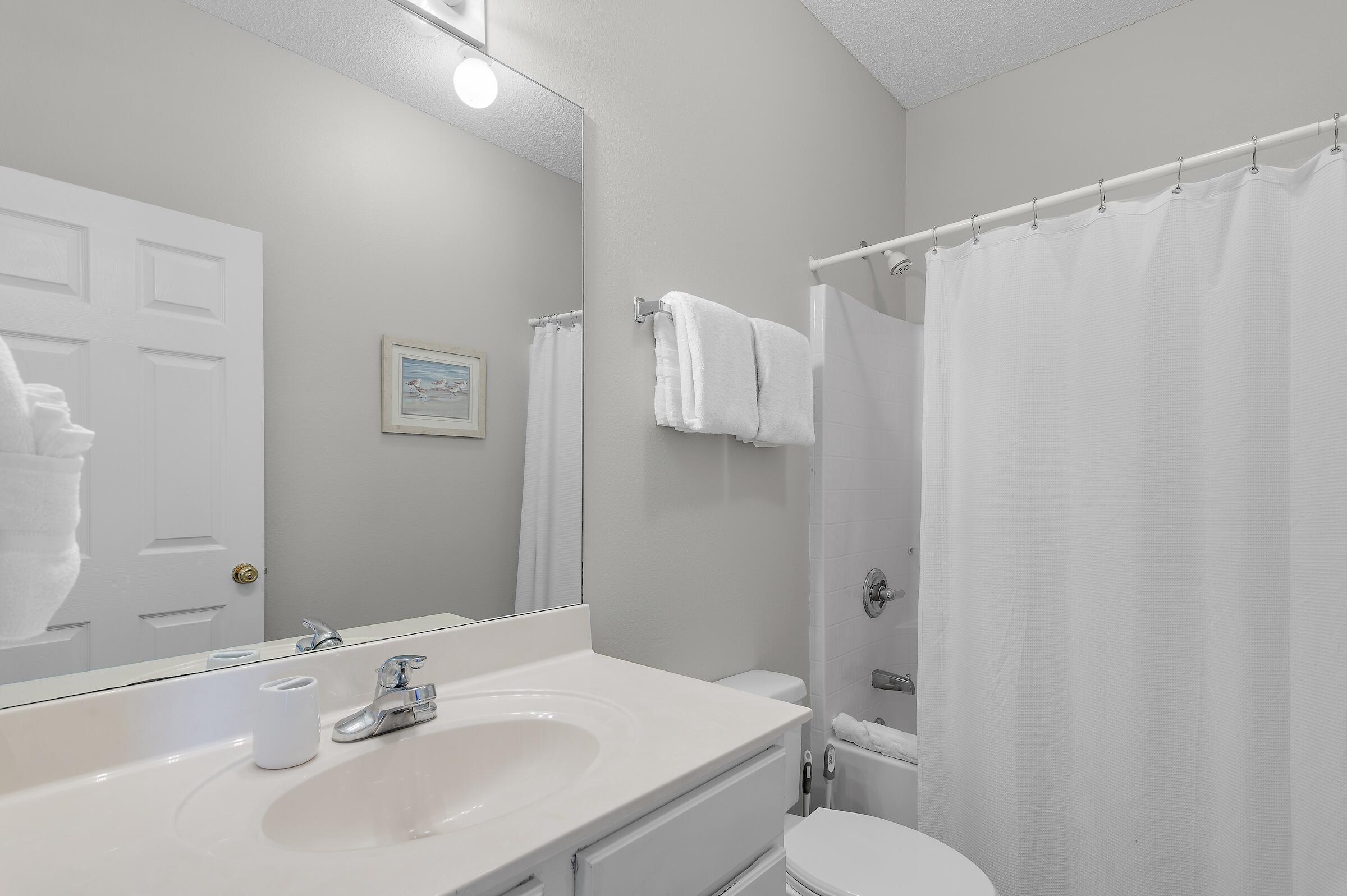 69 Seabreeze Trail Inlet Beach, FL 32461 - Photo 26 of 40 a bathroom with a sink vanity mirror and toilet