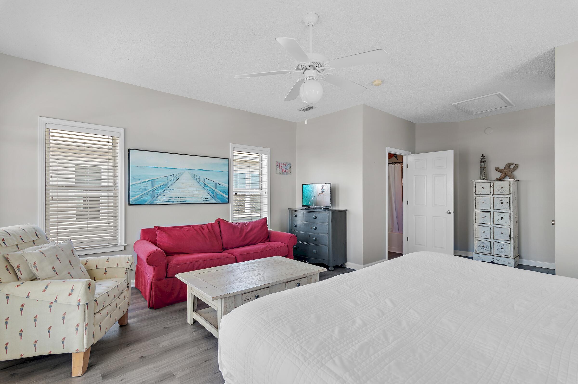 69 Seabreeze Trail Inlet Beach, FL 32461 - Photo 33 of 40 a bedroom with a bed and a couch