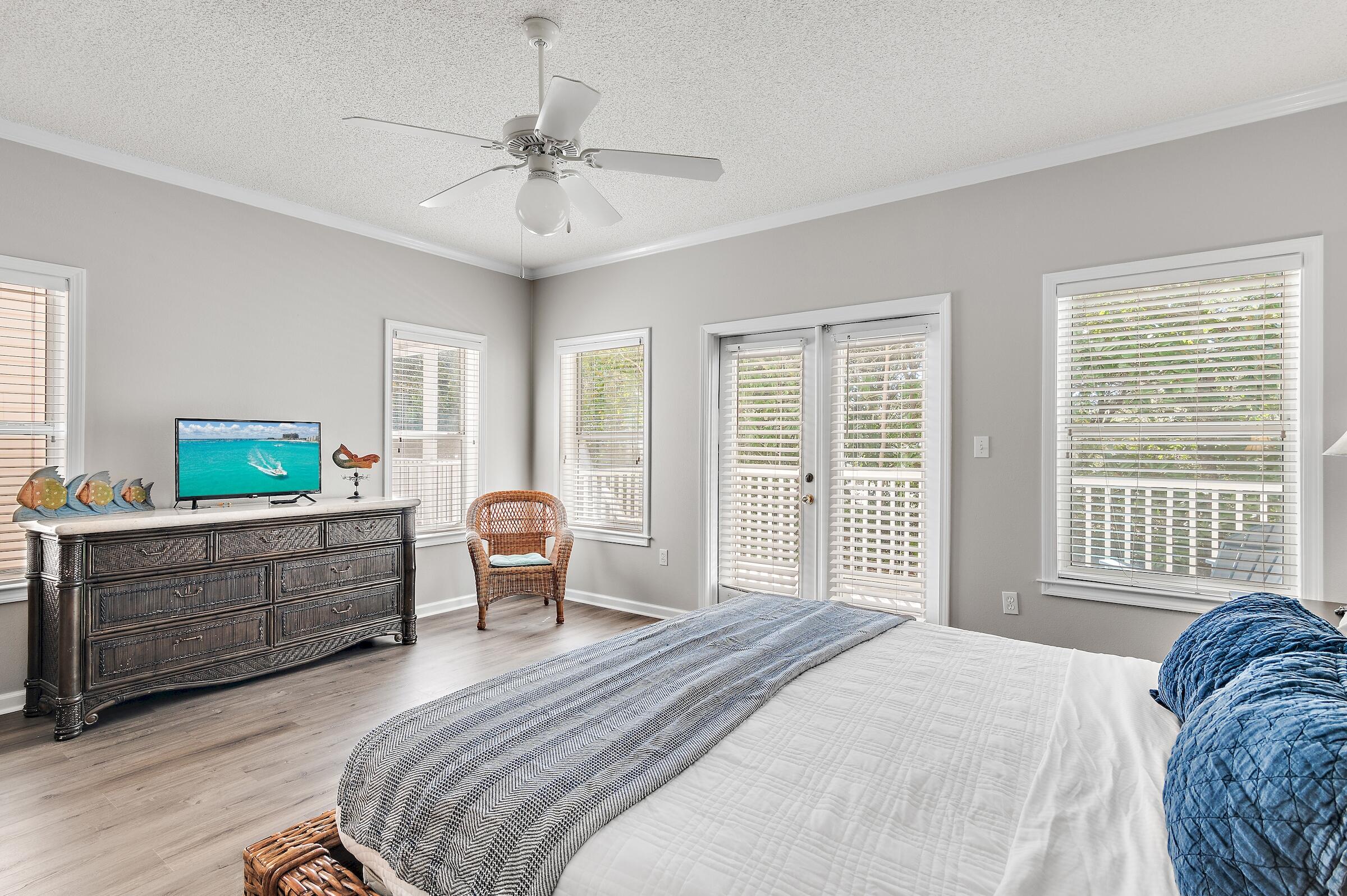 69 Seabreeze Trail Inlet Beach, FL 32461 - Photo 4 of 40 a bedroom with a bed and a chandelier