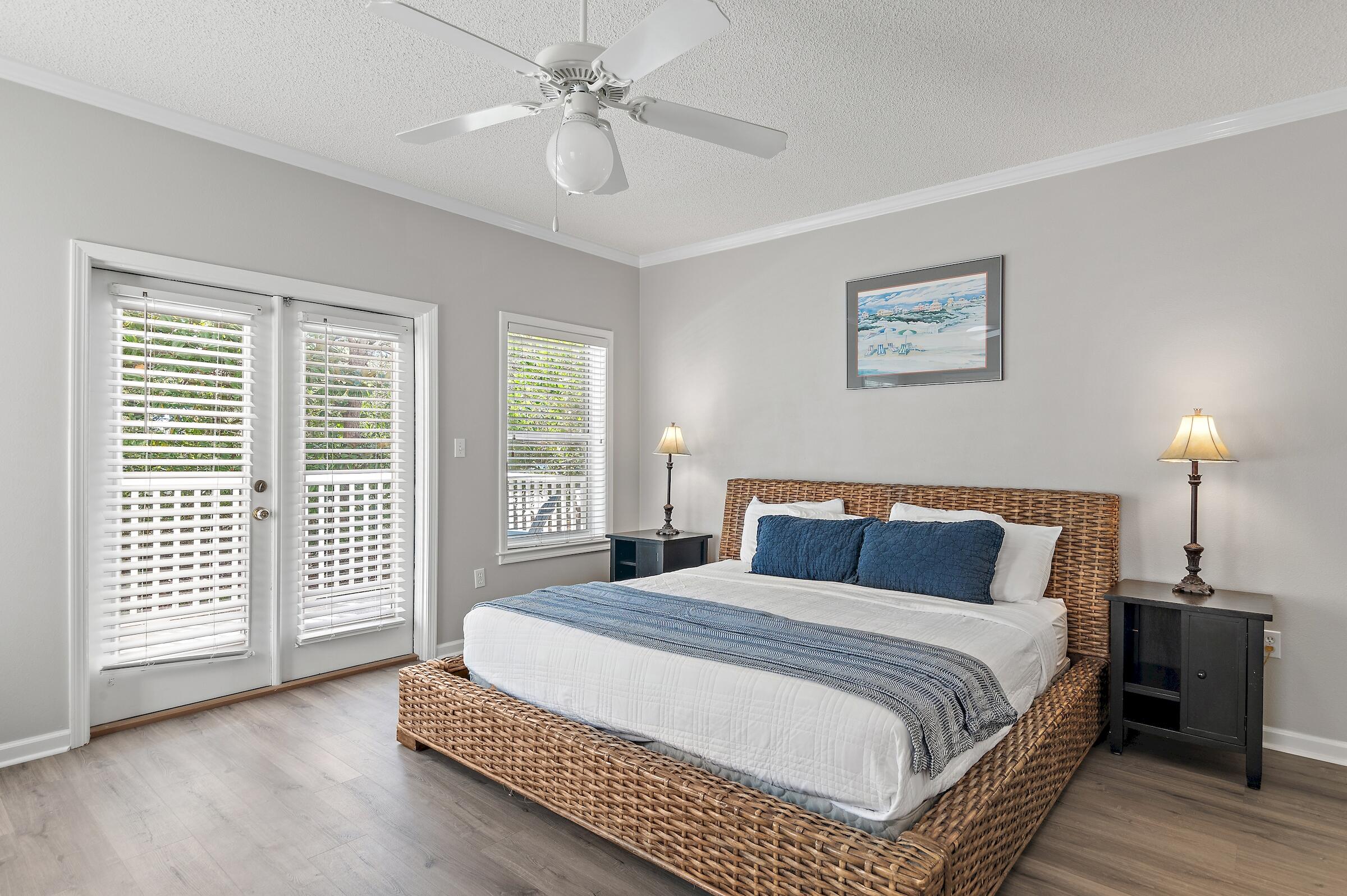 69 Seabreeze Trail Inlet Beach, FL 32461 - Photo 5 of 40 a bedroom with a large bed and a chandelier