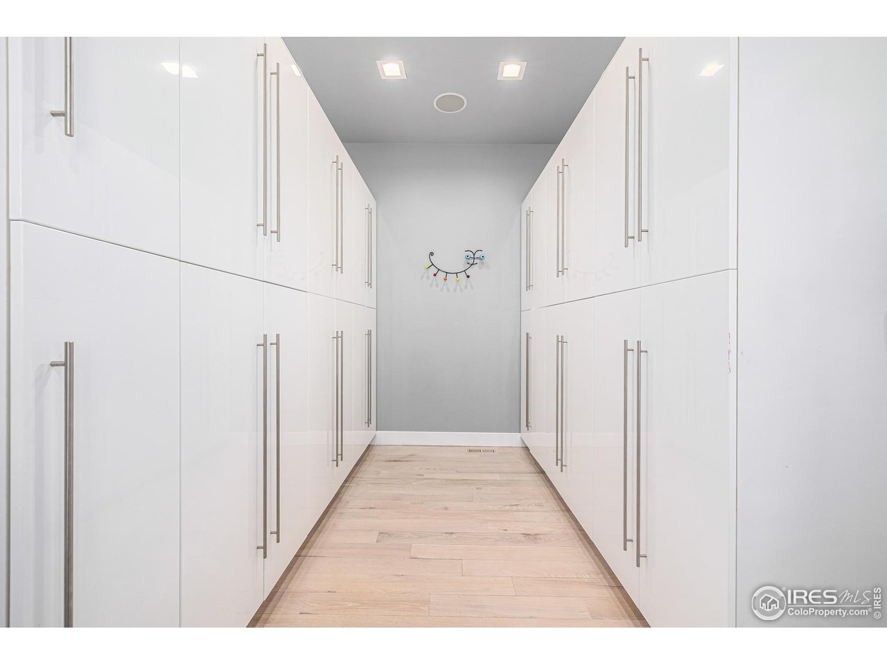 285 Commander Drive Erie, CO 80516 - Photo 17 of 40 a view of a hallway with white walls
