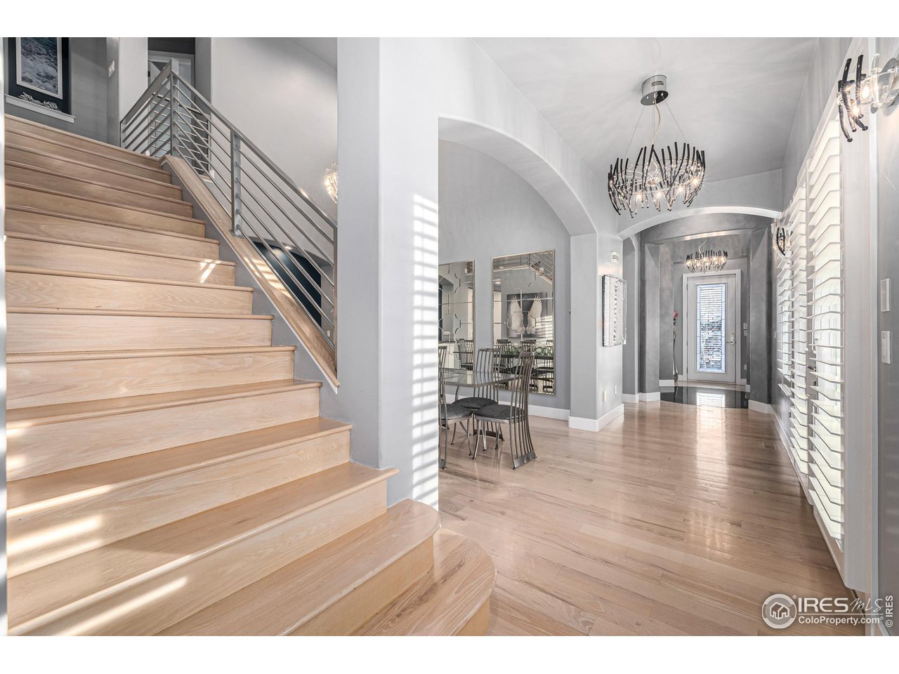 285 Commander Drive Erie, CO 80516 - Photo 20 of 40 a view of entryway and hall with wooden floor
