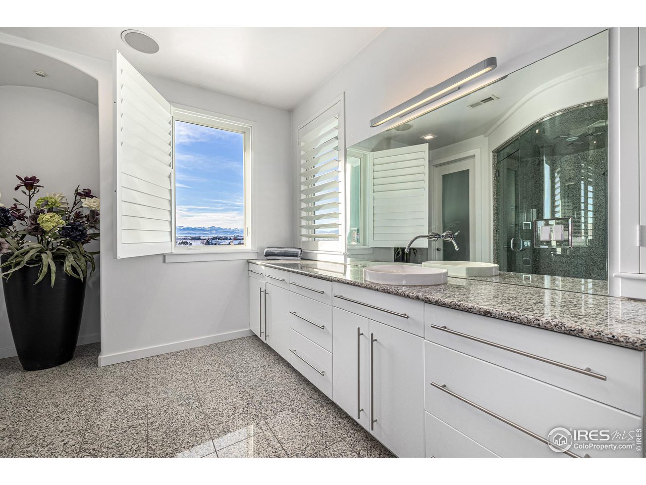 285 Commander Drive Erie, CO 80516 - Photo 26 of 40 a bathroom with a sink and a mirror