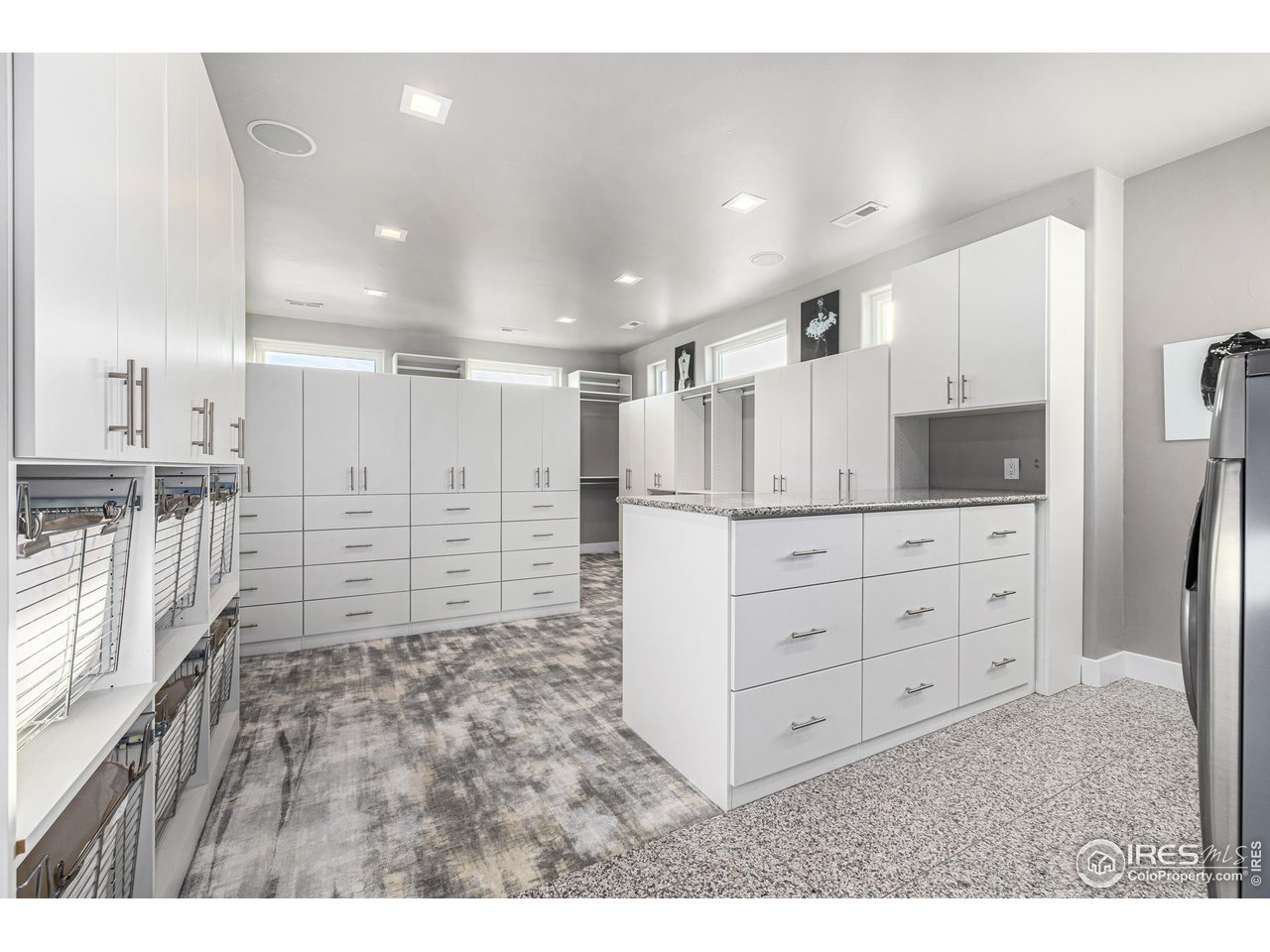285 Commander Drive Erie, CO 80516 - Photo 27 of 40 a view of a kitchen with white cabinets
