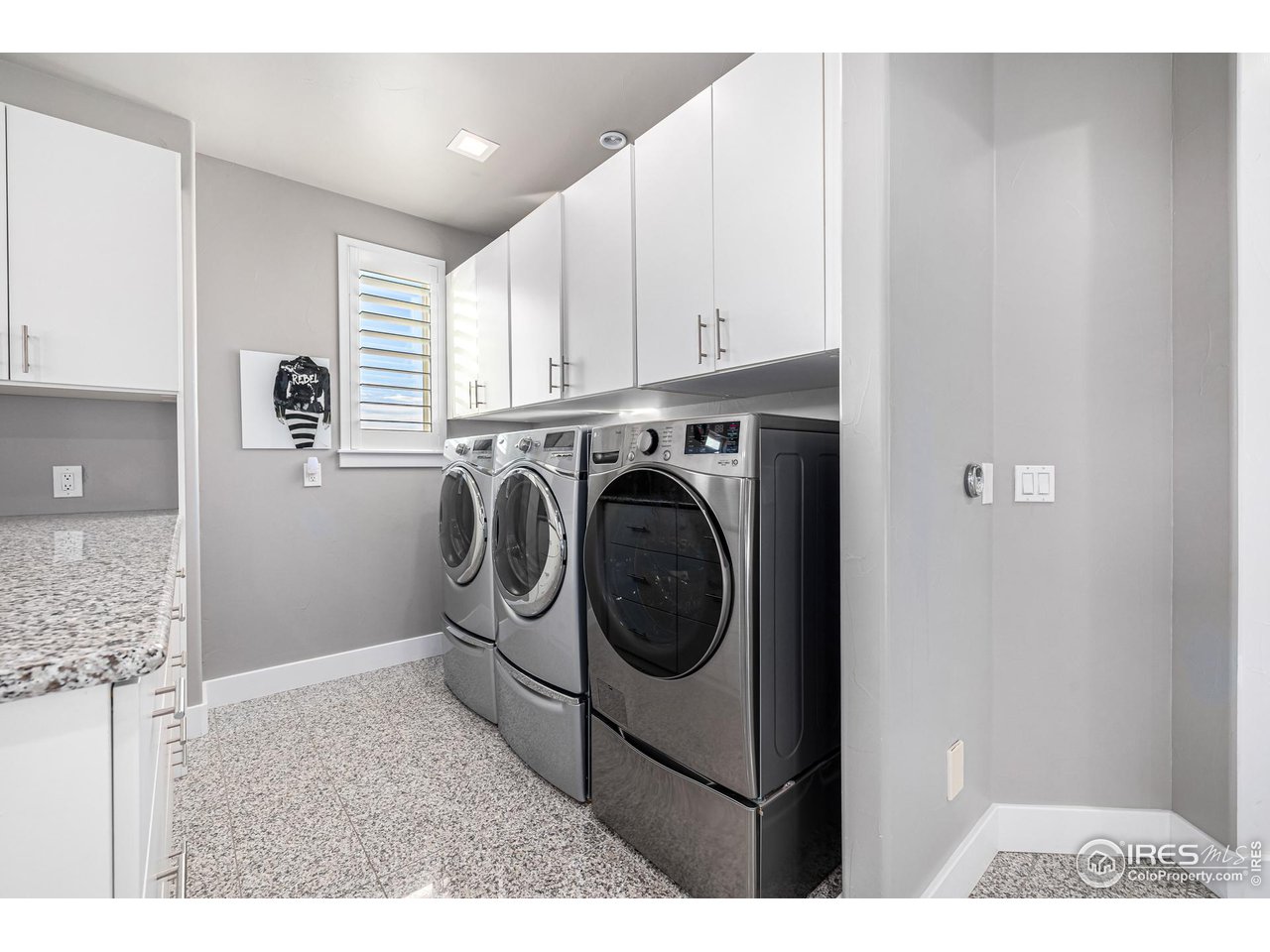285 Commander Drive Erie, CO 80516 - Photo 30 of 40 a view of entryway with washer and dryer