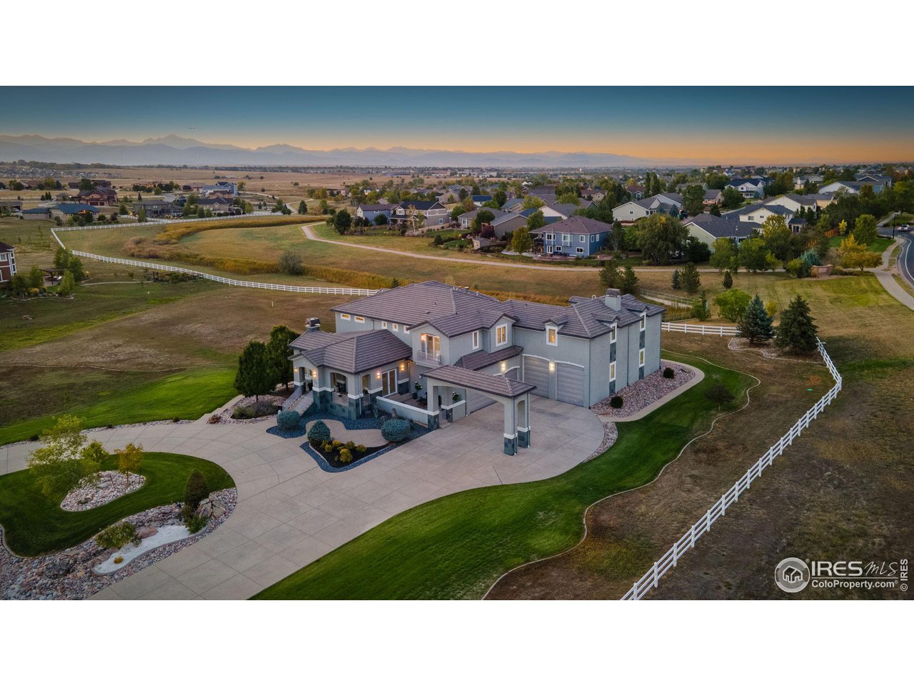 285 Commander Drive Erie, CO 80516 - Photo 3 of 40 a view of a lake with a garden and lake view