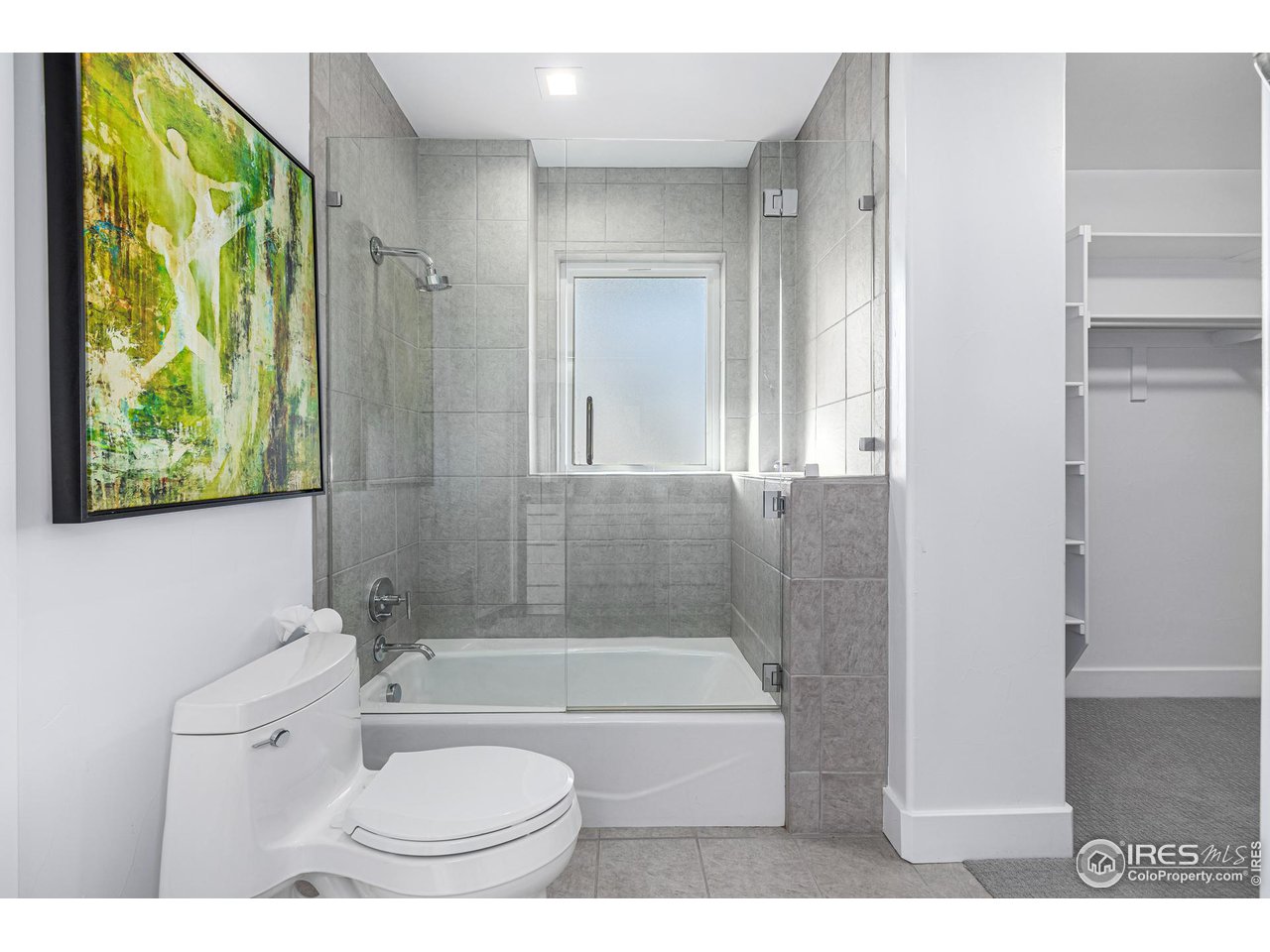 285 Commander Drive Erie, CO 80516 - Photo 34 of 40 a bathroom with a toilet a sink and bathtub