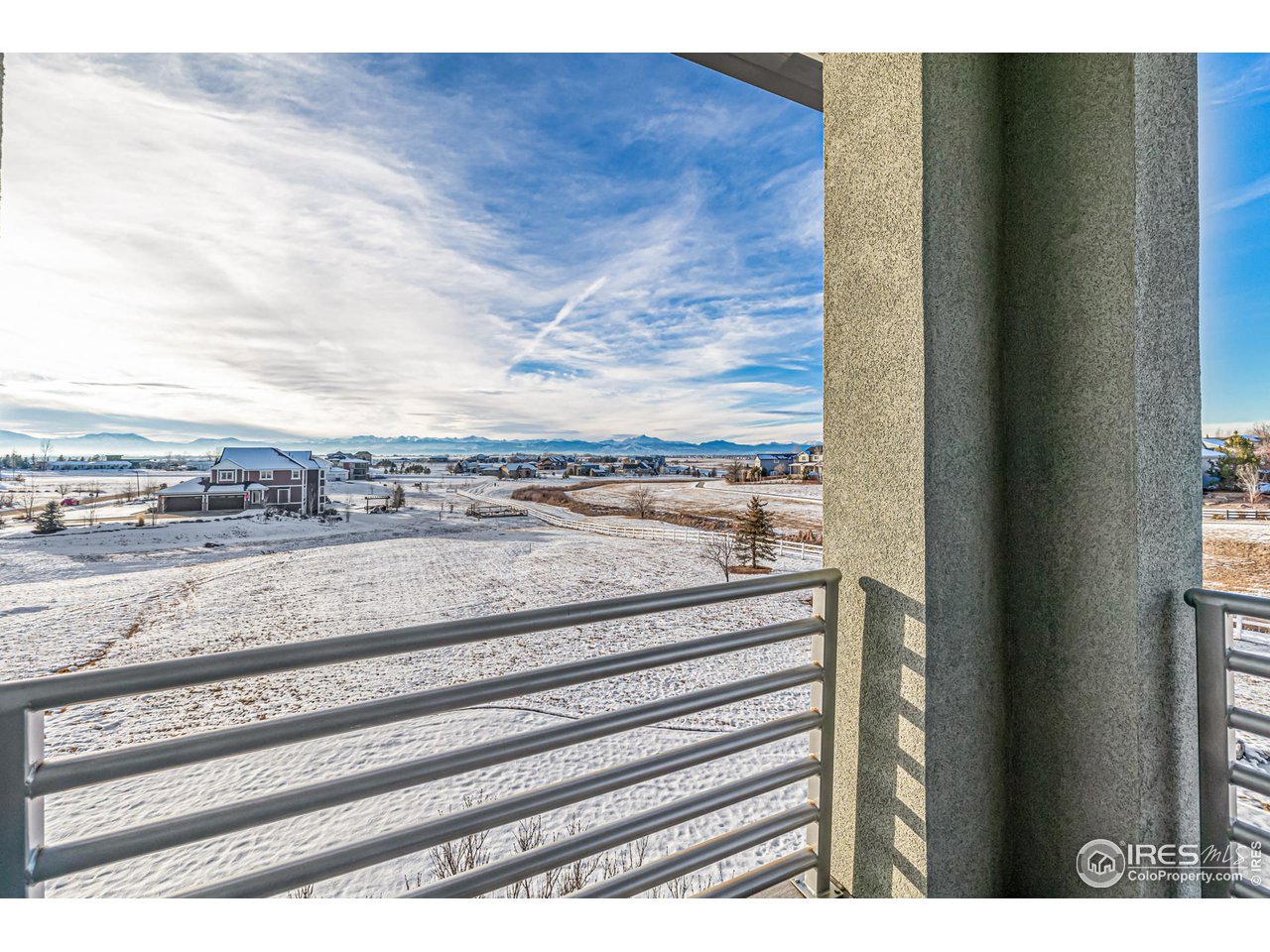 285 Commander Drive Erie, CO 80516 - Photo 37 of 40 a view of a floor to ceiling window and wooden floor