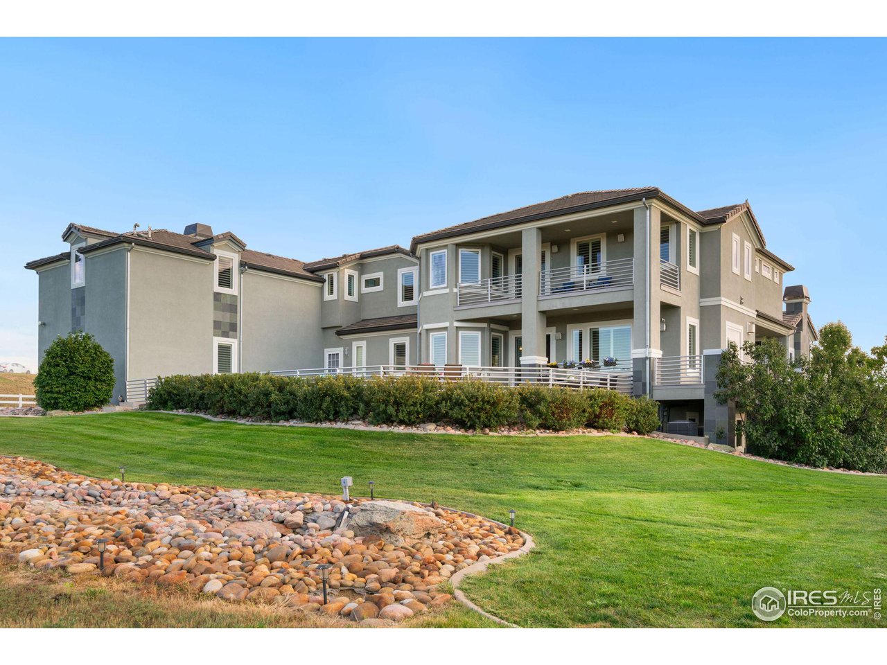 285 Commander Drive Erie, CO 80516 - Photo 5 of 40 a front view of a house with a yard