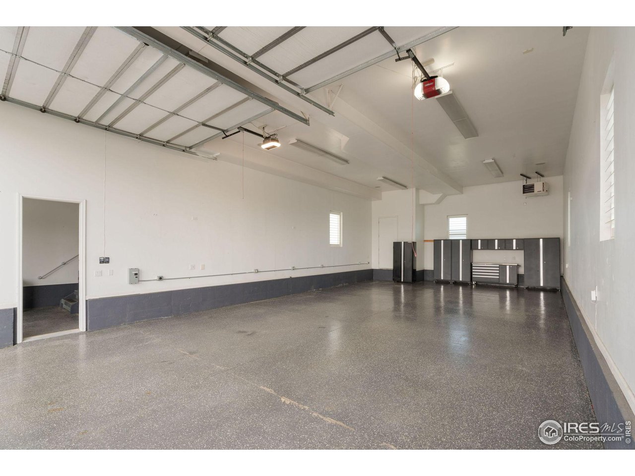 285 Commander Drive Erie, CO 80516 - Photo 8 of 40 a view of empty room with wooden floor