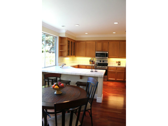 76 Images Circle Milpitas, CA 95035 - Photo 12 of 18 a kitchen with a table and chairs in it