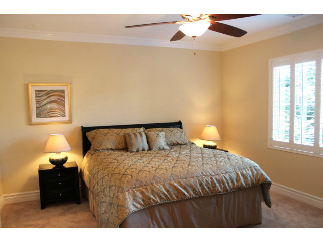 76 Images Circle Milpitas, CA 95035 - Photo 13 of 18 a bedroom with a bed and a chandelier